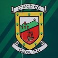 Mayo County GAA crest featuring a shield design with a green hill, a red background, a sailing ship, and the text "Maigh Eo" and "Crosserlough" below.