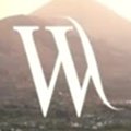 alt="Stylized letter 'W' with a scenic background of mountains and soft lighting, representing creativity and inspiration."